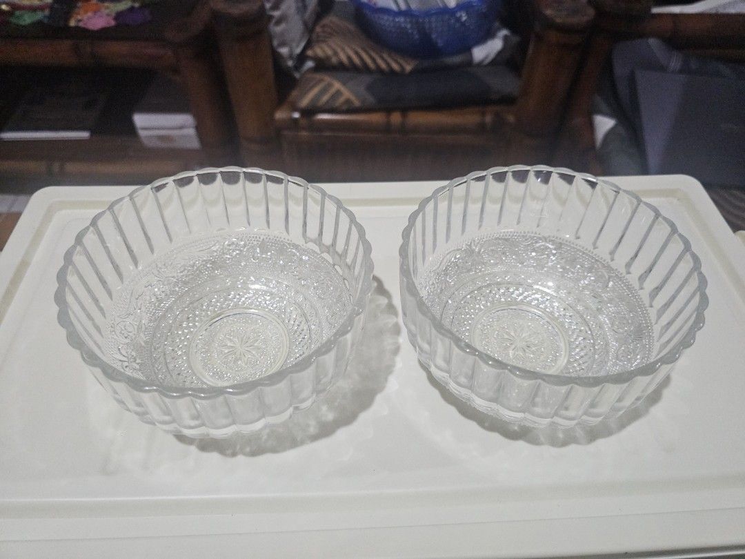 Set of 2 Clear Glass Bowls with Embossed Pattern (Category: Dinnerware & Cutlery) located in General Trias. Submitted by kittykate__ (Listing ID 1455069263, Image 1). Description: - Set of 2 clear glass bowls - Features beautiful embossed pattern on bottom and sides - Elegant fluted edges - Ideal for serving snacks, desserts, or as decorative pieces - Perfect size for individual servings - Clean and ready for a new home.