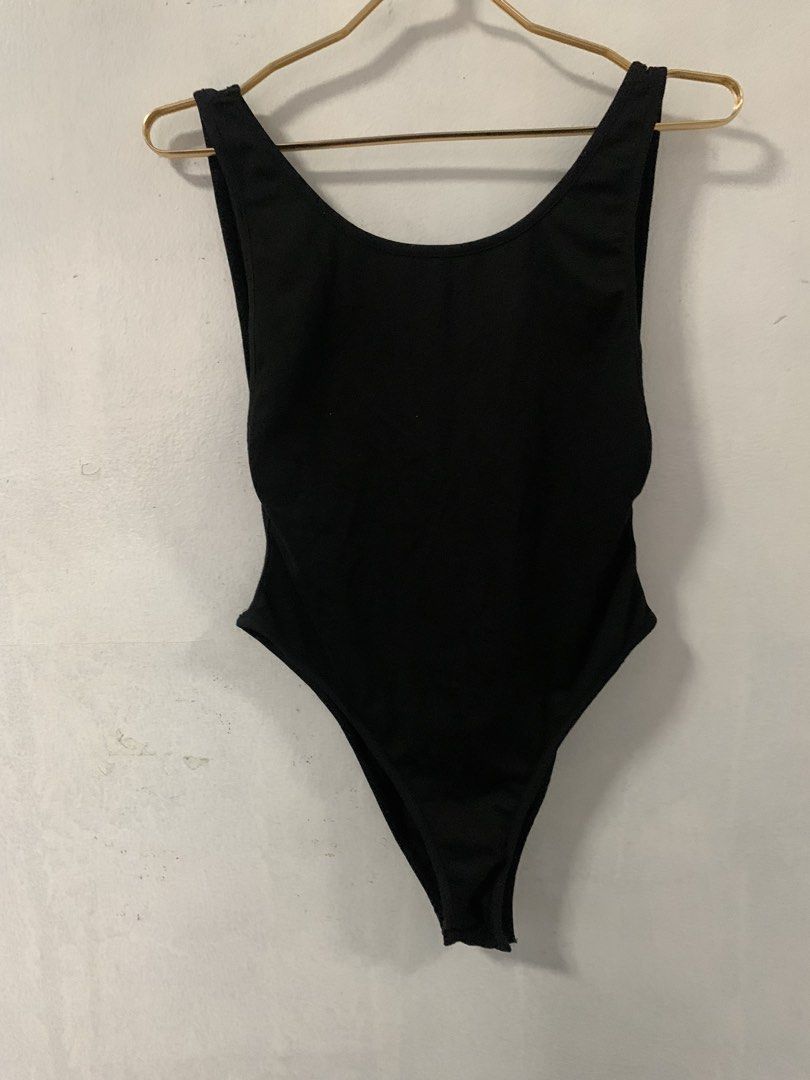 SHEIN Black High Cut Thong Bodysuit (Category: Others Tops) located in Malabon City. Submitted by vewonica (Listing ID 1454972868, Image 2). Description: - SHEIN Black Bodysuit - Size: Medium (M) - Style: High-cut leg, thong bottom - Neckline: Scoop neck - Back: Low scoop back - Material: Comfortable and stretchy - Versatile: Perfect for layering or wearing alone.