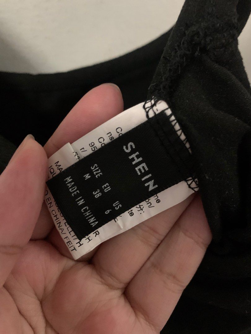 SHEIN Black High Cut Thong Bodysuit (Category: Others Tops) located in Malabon City. Submitted by vewonica (Listing ID 1454972868, Image 3). Description: - SHEIN Black Bodysuit - Size: Medium (M) - Style: High-cut leg, thong bottom - Neckline: Scoop neck - Back: Low scoop back - Material: Comfortable and stretchy - Versatile: Perfect for layering or wearing alone.