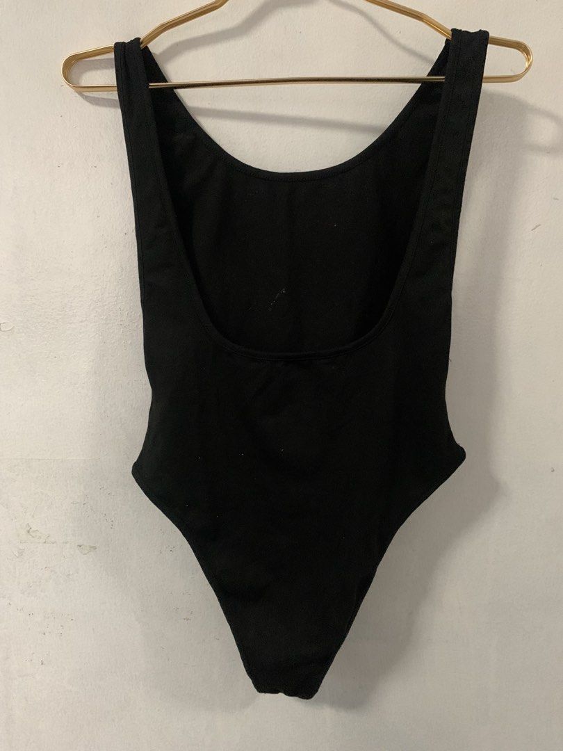 SHEIN Black High Cut Thong Bodysuit (Category: Others Tops) located in Malabon City. Submitted by vewonica (Listing ID 1454972868, Image 1). Description: - SHEIN Black Bodysuit - Size: Medium (M) - Style: High-cut leg, thong bottom - Neckline: Scoop neck - Back: Low scoop back - Material: Comfortable and stretchy - Versatile: Perfect for layering or wearing alone.