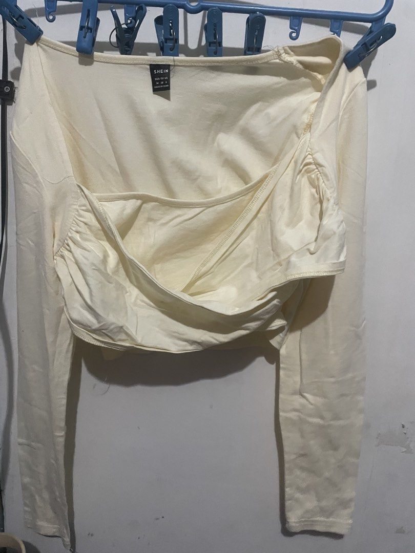 SHEIN long sleeve cross top, crop top (Category: Others Tops) located in Manila. Submitted by iaden (Listing ID 1454974239, Image 1). Description: Used once Cream color Size:l No issues.