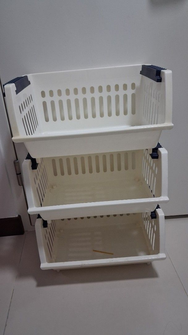 Stackable White Plastic Storage Baskets (Category: Storage Boxes & Baskets) located in Singapore. Submitted by letsbesimple (Listing ID 1455002539, Image 1). Description: - Set of 3 stackable storage baskets - White plastic with blue connecting clips - Ideal for organizing small items in cabinets or on shelves .