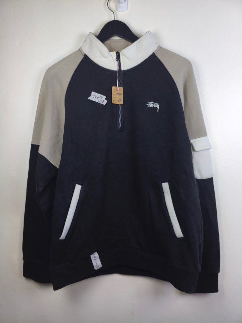 Stussy Colorblock Half Zip Sweatshirt (Category: Coats, Jackets and Outerwear) located in Manila. Submitted by declutterpromax (Listing ID 1455107528, Image 1). Description: - Stussy colorblock sweatshirt - Half zip neckline - Large front pocket - Raglan sleeves in beige - Main body: Black - Accents: Beige collar and cuffs - Size: L - Made in China.