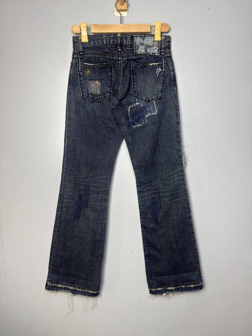 The Great China Wall Distressed Patchwork Flare Jeans (Category: Jeans) located in Manila. Submitted by dipdrip (Listing ID 1455081860, Image 2). Description: - Dark wash denim jeans - Flare leg silhouette - Distressed patches and frayed hems - Unique patchwork details on front and back - Button and zip closure - Cool, edgy vibe perfect for casual wear DIMENSIONS Waist : 27 fit 29 Length : 41 / Fold : 38 Thigh : 10.5 Inseam : 33.5 / Fold : 31 Leg