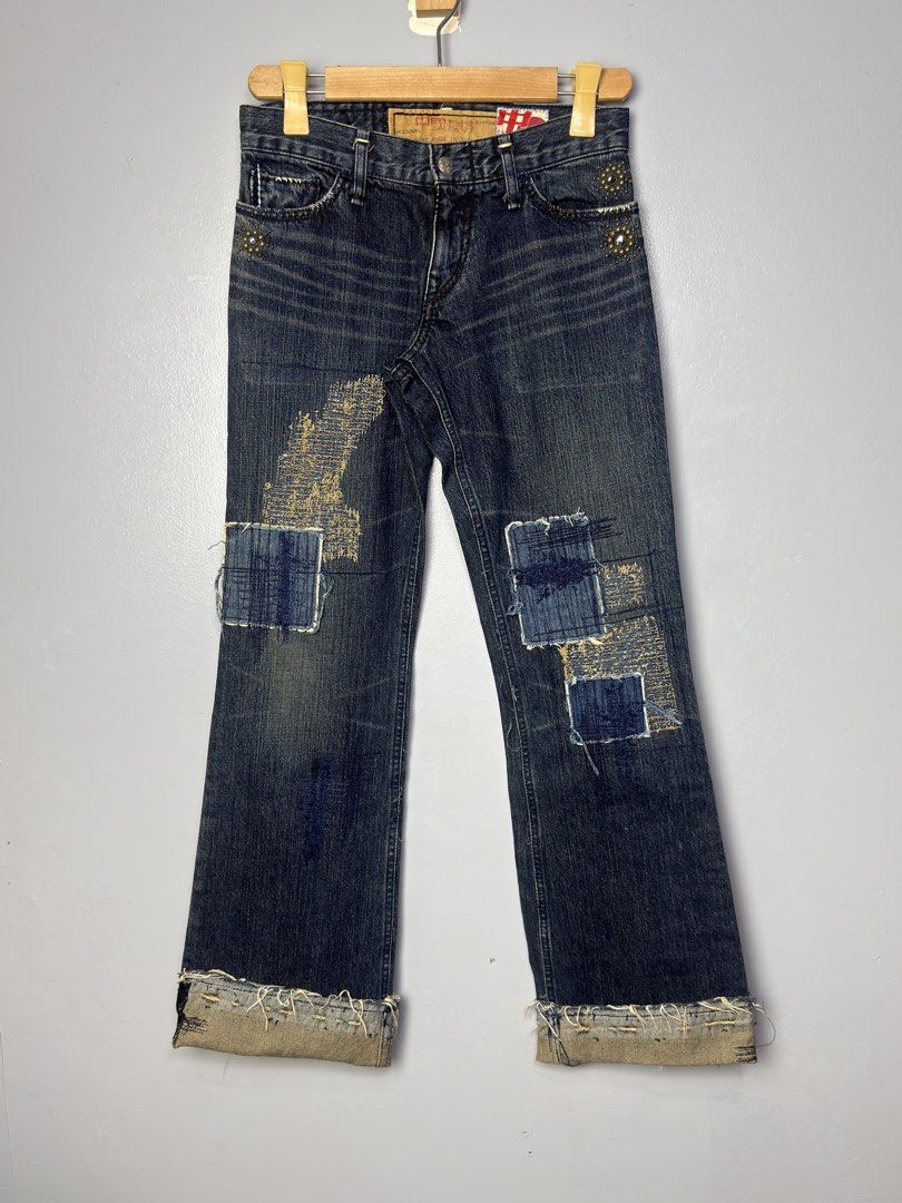 The Great China Wall Distressed Patchwork Flare Jeans (Category: Jeans) located in Manila. Submitted by dipdrip (Listing ID 1455081860, Image 3). Description: - Dark wash denim jeans - Flare leg silhouette - Distressed patches and frayed hems - Unique patchwork details on front and back - Button and zip closure - Cool, edgy vibe perfect for casual wear DIMENSIONS Waist : 27 fit 29 Length : 41 / Fold : 38 Thigh : 10.5 Inseam : 33.5 / Fold : 31 Leg