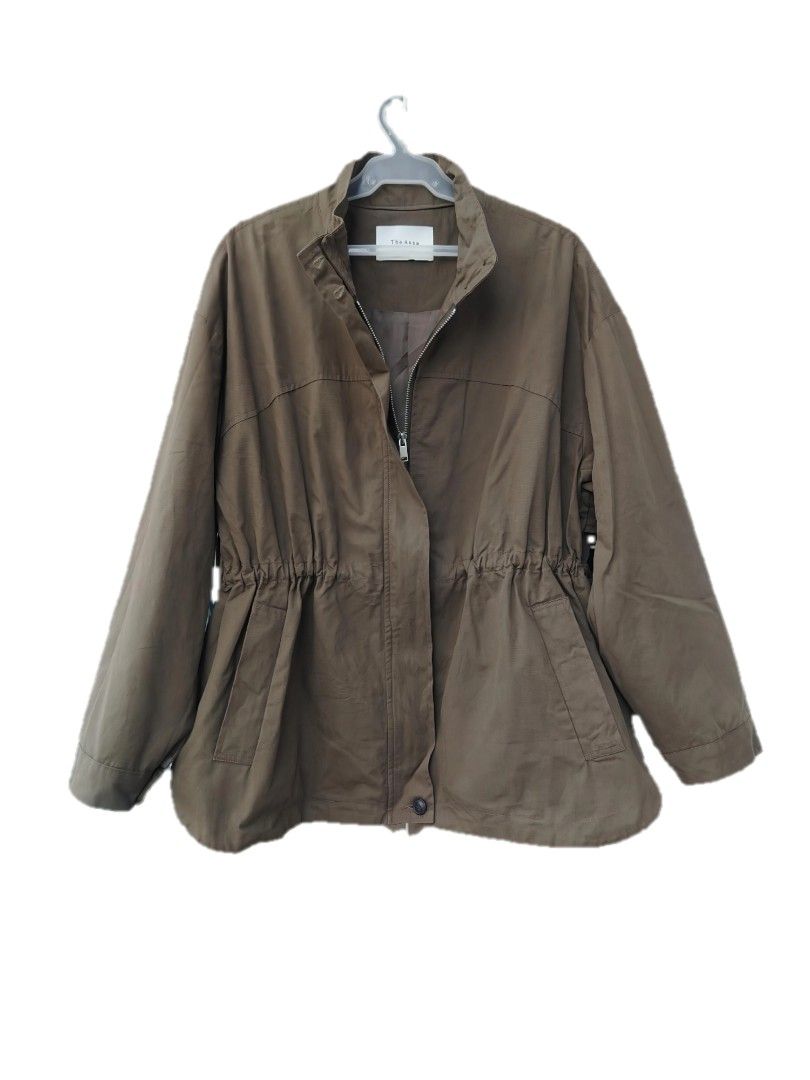 Theoria Khaki Utility Jacket with Drawstring Waist (Category: Coats, Jackets and Outerwear) located in Davao. Submitted by enchanted08 (Listing ID 1455036501, Image 2). Description: - Khaki utility jacket - Adjustable drawstring waist for a customized fit - Front closure with both zipper and buttons - Two functional front pockets - Stylish cape detail on the back - Ideal for layering over various outfits.