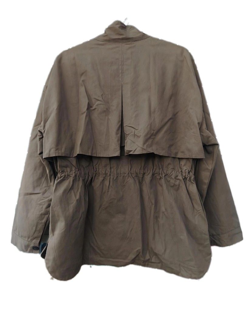 Theoria Khaki Utility Jacket with Drawstring Waist (Category: Coats, Jackets and Outerwear) located in Davao. Submitted by enchanted08 (Listing ID 1455036501, Image 3). Description: - Khaki utility jacket - Adjustable drawstring waist for a customized fit - Front closure with both zipper and buttons - Two functional front pockets - Stylish cape detail on the back - Ideal for layering over various outfits.