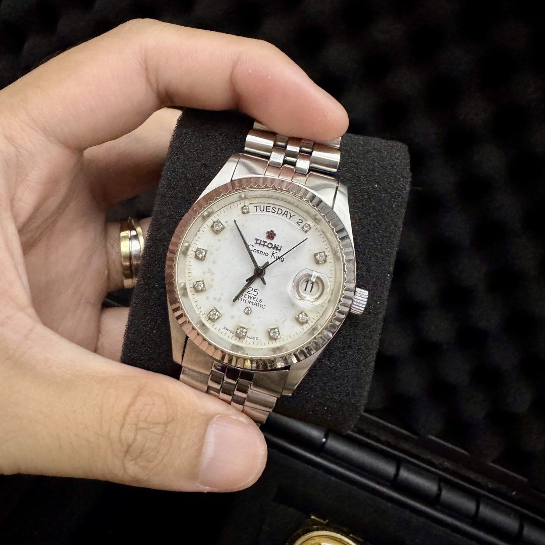 Titoni Cosmo King Day-Date (Category: Luxury Watches) located in Taguig. Submitted by miltimepieces (Listing ID 1455134238, Image 1). Description: Titoni Cosmo King Day-Date • Swiss Made • Automatic Movement • White Dial • Day-Date Display • Flutted Bezel • 36mm Case Size • Stainless Steel • Naked Meet-up: BGC Shipping: LBC Nationwide Same-Day Delivery: Grab (within serviceable areas) ₱ 14,500 Pre-owned / As-Is. Watch remains in good vintage cond
