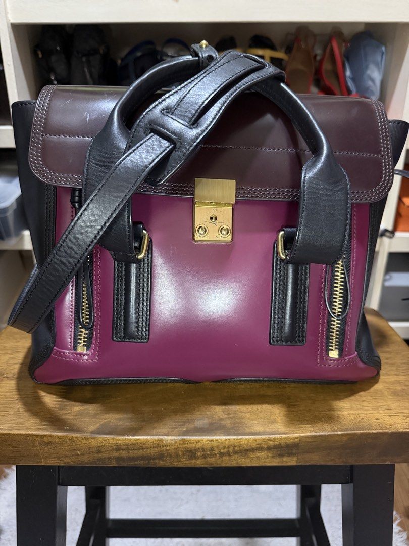 Tote bag (Category: Luxury Bags & Wallets) located in Pasig City. Submitted by emashopaholic (Listing ID 1455037896, Image 1). Description: Pre owned 3.1 Phillip Lim Pashli satchel Magenta/burgundy/black combo With long, leather strap With dust bag Issue: a few scratches on the lock A few scratches on the flap Gold hardware Selling low for only ₱ 19,500 Pasig pick up Shipping c/o buyer Bdo/bpi .
