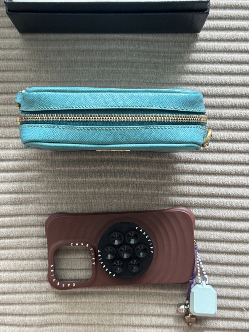 turquoise Prada Saffiano Leather Mini Camera Bag (Category: Luxury Bags & Wallets) located in Pasig City. Submitted by jesych (Listing ID 1454998057, Image 3). Description: - Authentic Prada Saffiano Leather Mini Camera Bag - Stunning turquoise color - Durable Saffiano leather material - Versatile crossbody style - Comes with original box and authenticity card - Perfect for adding a touch of luxury to your everyday look.