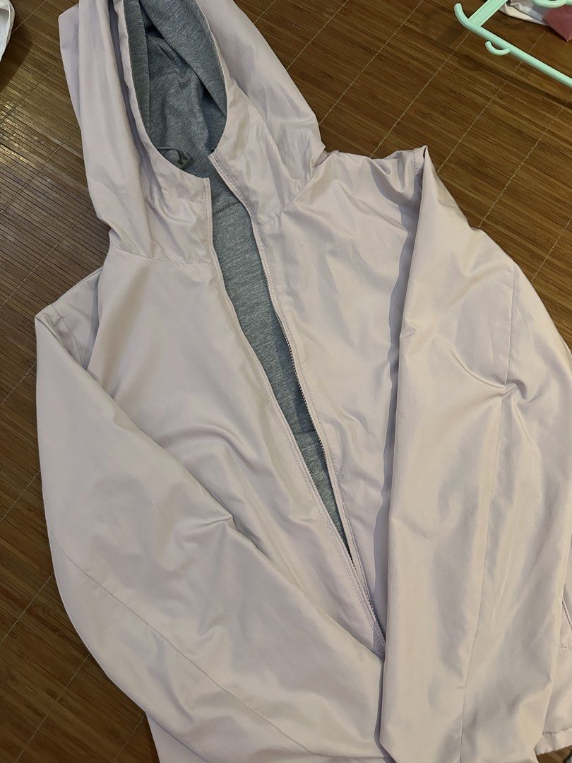 Uniqlo reversible parka (Category: Coats, Jackets and Outerwear) located in Valenzuela. Submitted by sol___ (Listing ID 1455112047, Image 2). Description: - Lightweight hooded jacket - Soft lilac color with grey inner lining - Zipper closure - Ideal for layering or as a light windbreaker - Easy to pack and carry Barely worn .