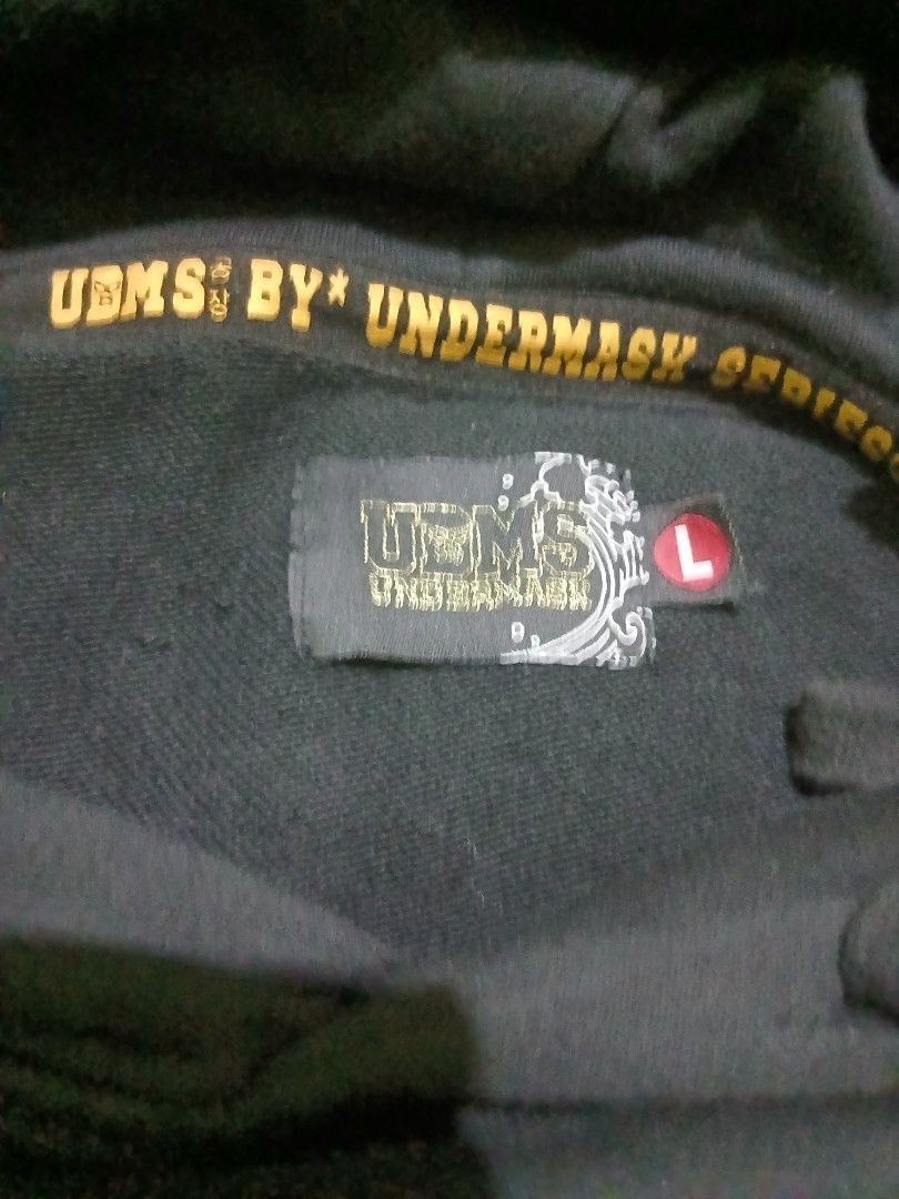 UBMS BY UNDERMASK Dragon Print Hoodie (Category: Coats, Jackets and Outerwear) located in Bulacan. Submitted by esecleus (Listing ID 1455088697, Image 3). Description: - Black hoodie with striking dragon graphics on front and sleeves. - Unique tag featuring Japanese-inspired art and a tiger. - Includes UBMS BY UNDERMASK label. - Comfortable and stylish design..