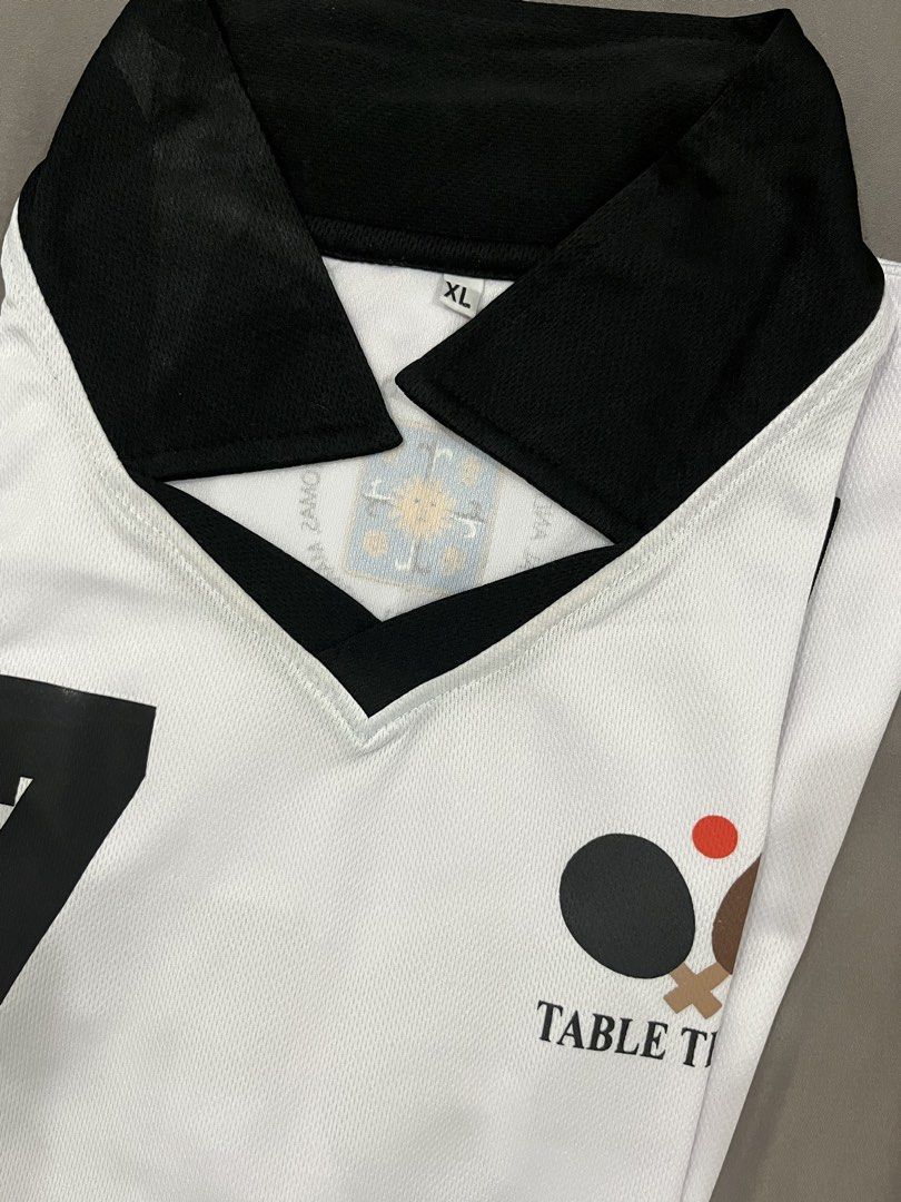 UST Pathfit Table Tennis Uniform (XL, Top only) (Category: Activewear) located in Quezon City. Submitted by d.zei (Listing ID 1455052708, Image 1). Description: - lady owned !! - bought directly from ust portal - used for less than 10 meetings - selling shirt/top only - size: XL - has number 27 but it can me removed - see pics for condi !! mop: gcash, maribank, maya, or cash if meet up .