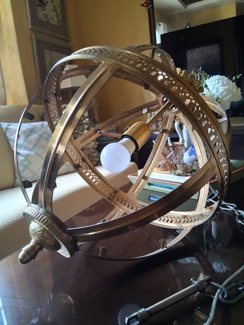 Vintage Brass Globe Pendant Light Fixture (Category: Lighting) located in Bacoor. Submitted by 12.23_06 (Listing ID 1455001502, Image 2). Description: - Unique brass globe pendant light - Intricate detailing and spherical design - Comes with a hanging chain - size: chain: 40 inches circumference: 50 inches diameter: 16 inches - Bulb included - Ready to install.