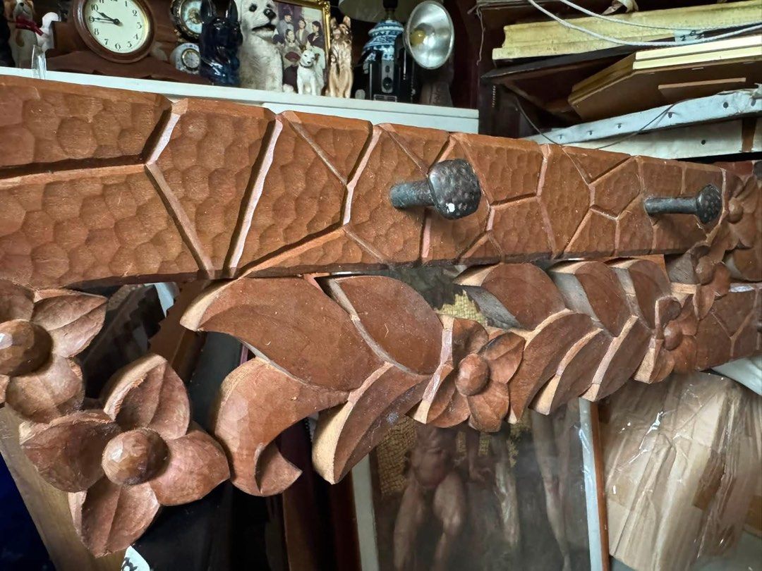 Vintage Hand-Carved Solid Wood Wall Rack Coat Hanger Floral (Category: Hooks & Hangers) located in Cainta. Submitted by elainelawenko (Listing ID 1454983421, Image 2). Description: - Vintage hand-carved solid wood wall rack/coat hanger. - Features intricate floral and leaf relief details. - Includes textured geometric panel accents. - Equipped with sturdy wooden peg hooks. - Dimensions: 6 inches x 35.5 inches. - A unique and charming piece for yo