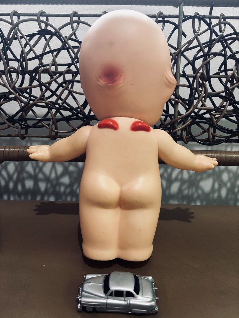 Vintage Kewpie Doll (Category: Vintage Collectibles) located in Manila. Submitted by millenial_cabinet (Listing ID 1455073102, Image 2). Description: - Vintage Kewpie doll, great for display. - Features classic painted details. - Comes with a small silver toy car. - Perfect for collectors or unique home decor. - Minor marks consistent with age..