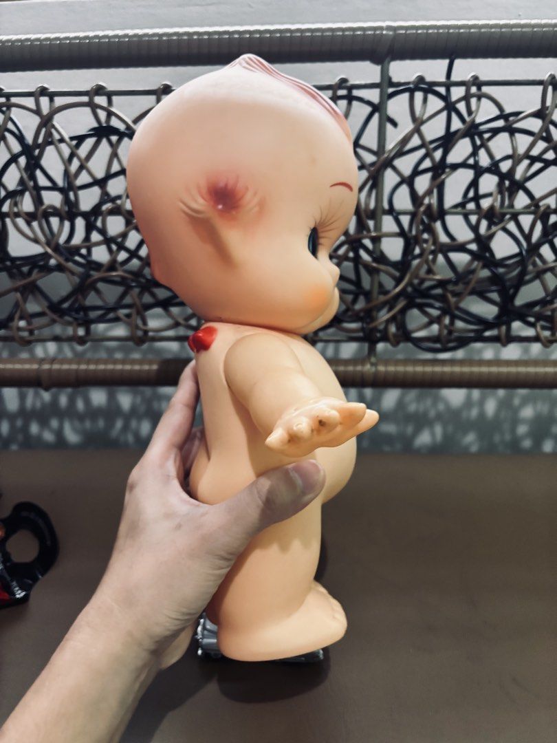 Vintage Kewpie Doll (Category: Vintage Collectibles) located in Manila. Submitted by millenial_cabinet (Listing ID 1455073102, Image 3). Description: - Vintage Kewpie doll, great for display. - Features classic painted details. - Comes with a small silver toy car. - Perfect for collectors or unique home decor. - Minor marks consistent with age..