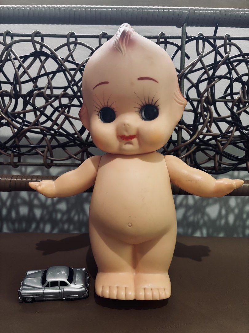Vintage Kewpie Doll (Category: Vintage Collectibles) located in Manila. Submitted by millenial_cabinet (Listing ID 1455073102, Image 1). Description: - Vintage Kewpie doll, great for display. - Features classic painted details. - Comes with a small silver toy car. - Perfect for collectors or unique home decor. - Minor marks consistent with age..