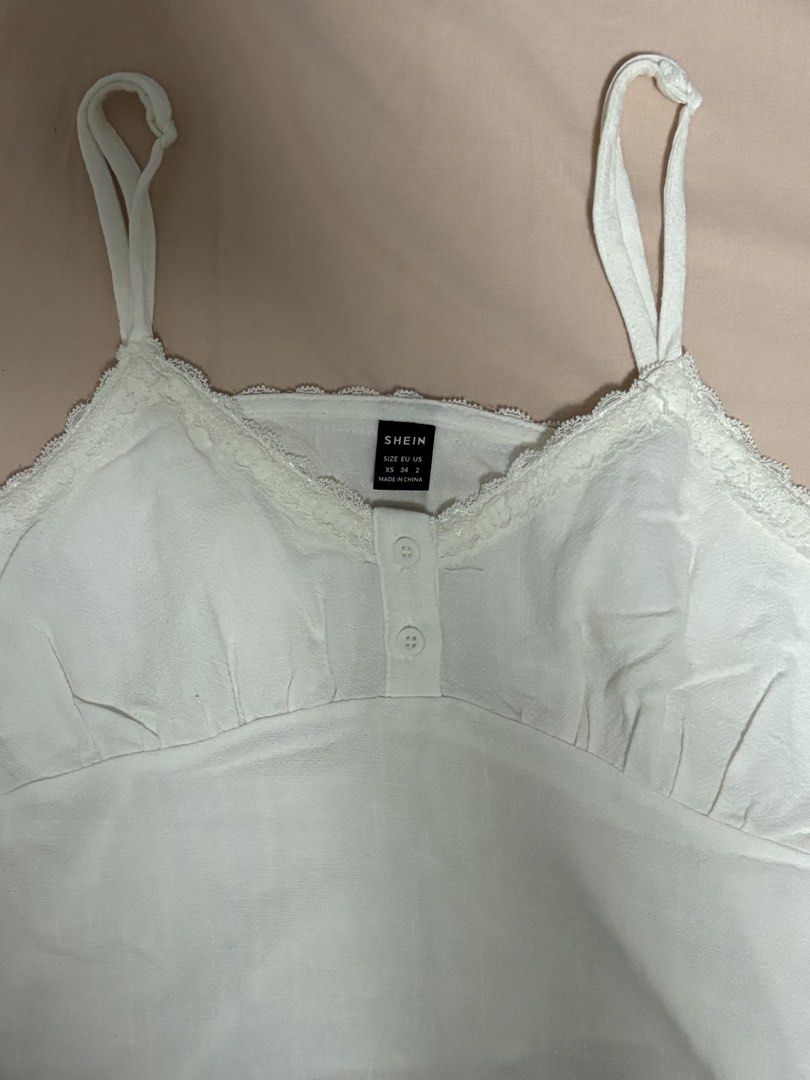 White Cami Camisole Lace Top - COSMINA SHEIN (Category: Sleeveless) located in Manila. Submitted by felookie (Listing ID 1455110721, Image 3). Description: ⭑ Fits XS-S ⭑ Reason For Selling: Decluttering clothes ⭑ Condition: Good condition, never worn outside just washed 📍Sta. Rosa Laguna 🛵 J&T or Lalamove delivery 💸 GCASH - Mine now, Pay now 🚫 STRICTLY NO refunds nor returns 📝 Expect the sf to be around ₱40-₱200 depending on your location an