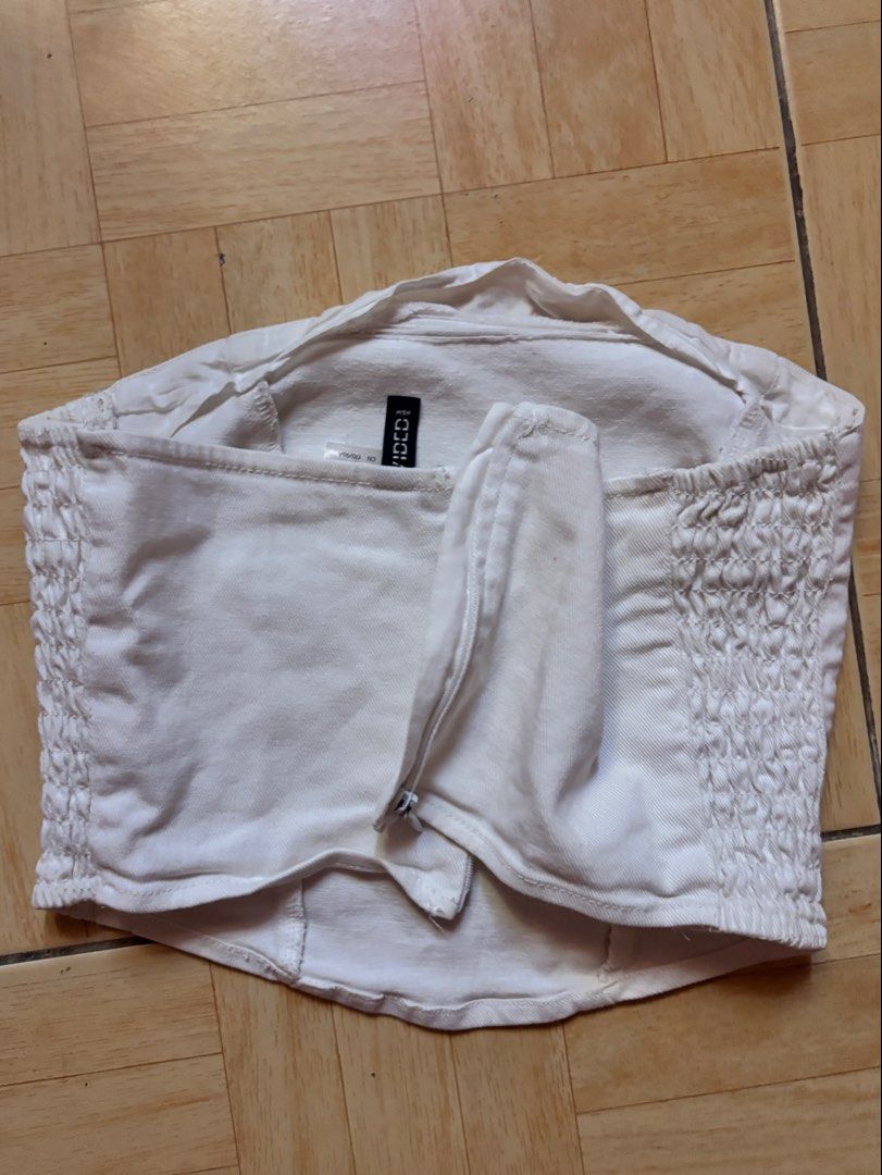 White Denim Smocked Tube Top (Category: Sleeveless) located in Pateros City. Submitted by pxlliix (Listing ID 1455031964, Image 3). Description: - White denim tube top - Smocked sides for a stretchy, comfortable fit - Zipper closure at the back - Estimated size: Small (S) - Ideal for summer outfits - Versatile: dress up or down - nego for sure buyer - item may vary due to lighting - preloved please manage your expectations - small to medium .