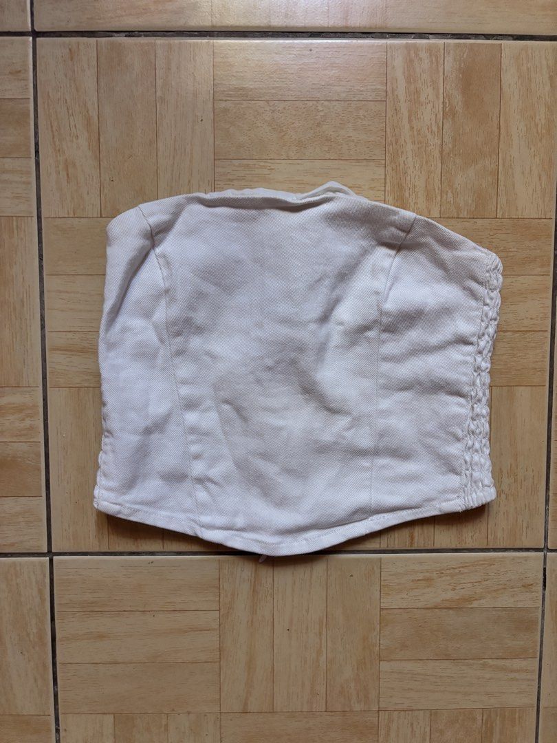 White Denim Smocked Tube Top (Category: Sleeveless) located in Pateros City. Submitted by pxlliix (Listing ID 1455031964, Image 1). Description: - White denim tube top - Smocked sides for a stretchy, comfortable fit - Zipper closure at the back - Estimated size: Small (S) - Ideal for summer outfits - Versatile: dress up or down - nego for sure buyer - item may vary due to lighting - preloved please manage your expectations - small to medium .