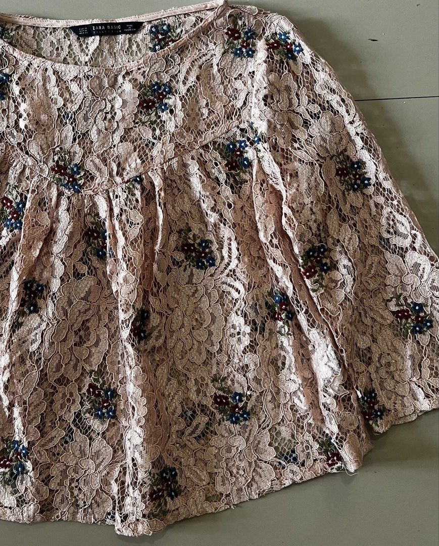 Zara Basic Floral Embroidered Pink Lace Blouse (Category: Others Tops) located in Malay. Submitted by spacetrips (Listing ID 1454994950, Image 3). Description: Delicate blush pink sheer lace fabric featuring intricate floral embroidery accents in blue, maroon, and green Flattering round neckline with a empire-style seam and subtle gathers for a relaxed, flowy silhouette 3/4 bell/wide sleeves with sheer lace detailing Perfect for layering over a c