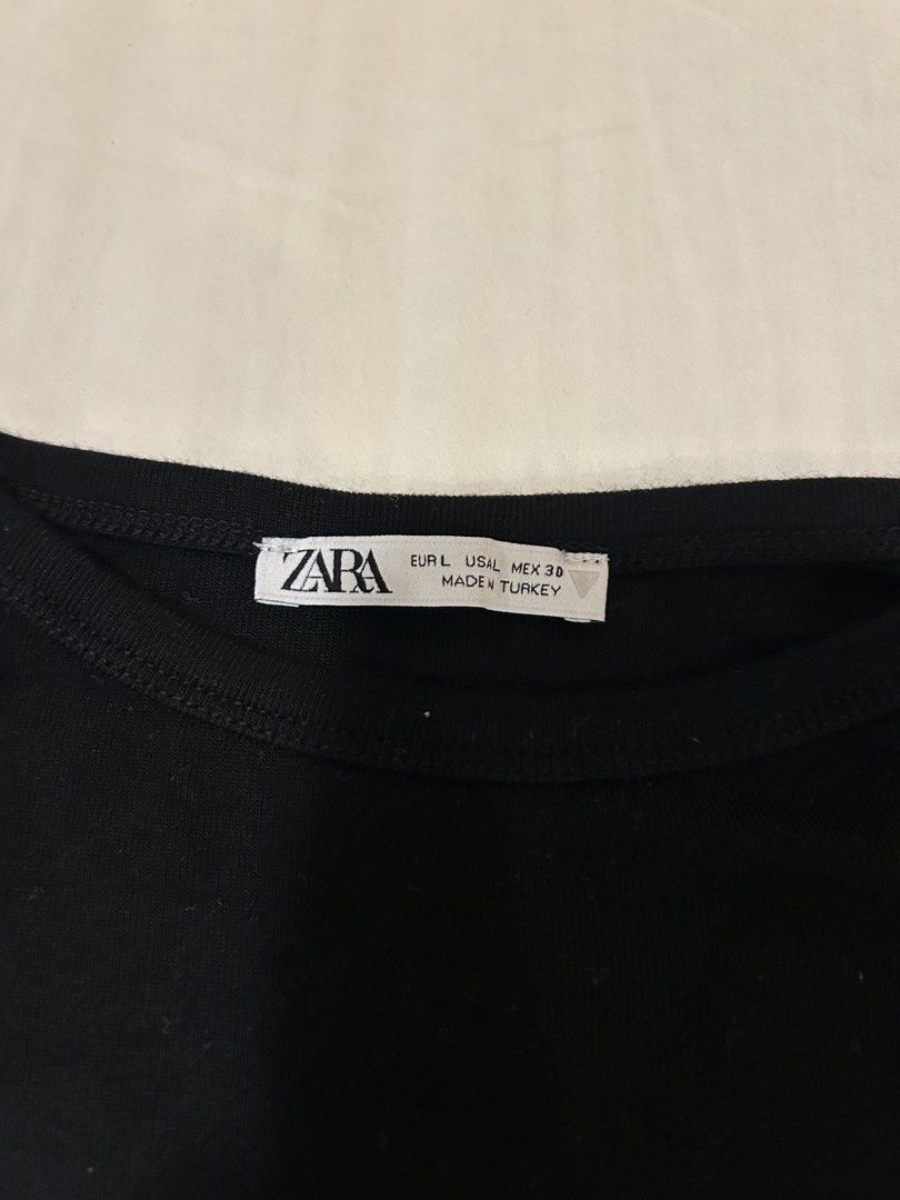 Zara Black Cropped T-Shirt (Category: Shirts) located in Quezon City. Submitted by m4delineee (Listing ID 1455125112, Image 2). Description: - size: L but still hangs as crop top on S - have same top in white; getting both = discount 🩷.