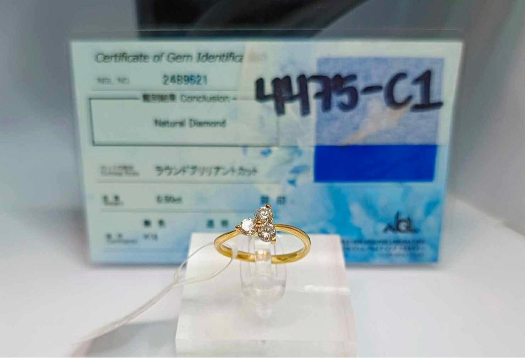 18K Gold Natural Diamond Ring with Gem Identification Certificate (Category: Rings) located in Quezon City. Submitted by rhonadc (Listing ID 1455219492, Image 2). Description: - Genuine 18K gold band - Features three natural diamonds - Total carat weight: 0.50ct - Diamond cut: Round brilliant - Certificate of gem identification included - Ideal for gifting or personal collection.