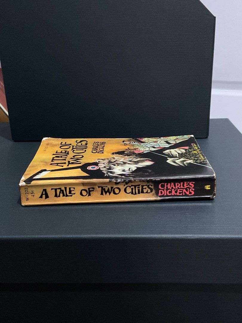 A Tale of Two Cities by Charles Dickens (Category: Storybooks) located in Manila. Submitted by smnrys (Listing ID 1455295930, Image 2). Description: - Classic novel: A Tale of Two Cities by Charles Dickens - Edition: Washington Square Press paperback - Features: Striking cover art - Condition: Pages yellowed with age, some water stains on inside cover - Ideal for: Book collectors.