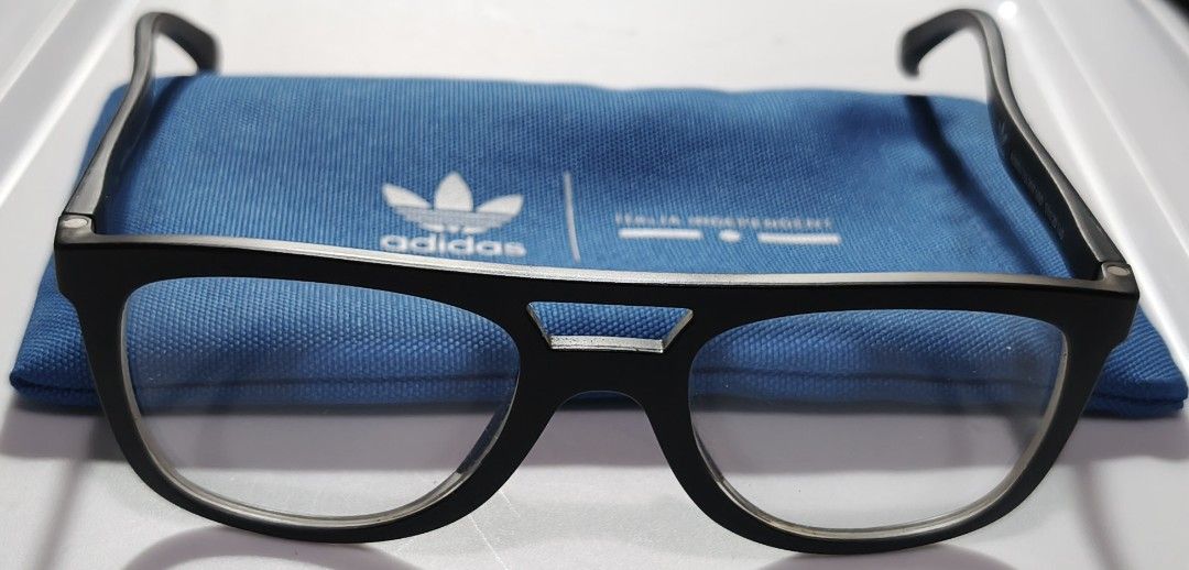 Adidas Italia Independent (Category: Sunglasses & Eyewear) located in General Trias. Submitted by ecsandt (Listing ID 1455274907, Image 1). Description: + Matte Black Frame Eyeglasses + Includes: Blue Adidas pouch + Versatile style for everyday wear or fashion statement + Feature: Clean design, ready for prescription lenses.