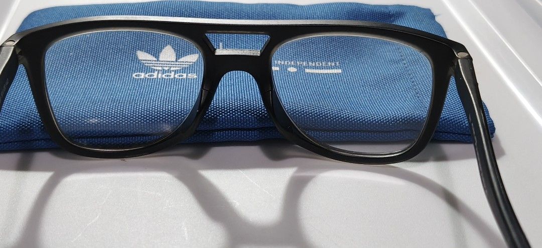 Adidas Italia Independent (Category: Sunglasses & Eyewear) located in General Trias. Submitted by ecsandt (Listing ID 1455274907, Image 2). Description: + Matte Black Frame Eyeglasses + Includes: Blue Adidas pouch + Versatile style for everyday wear or fashion statement + Feature: Clean design, ready for prescription lenses.