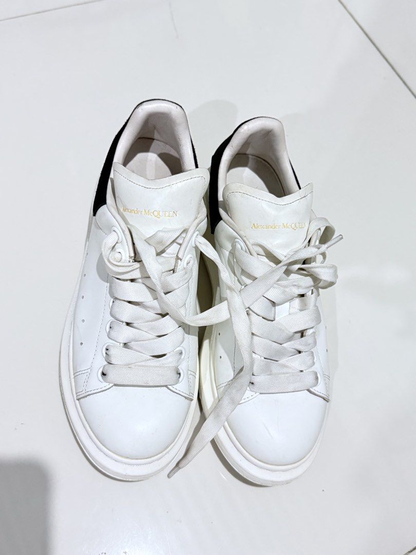 Alexander McQueen Oversized Sneakers White Black Size 39 (Category: Sneakers) located in Paranaque City. Submitted by thousandfold (Listing ID 1455257453, Image 1). Description: - Authentic Alexander McQueen Oversized Sneakers - Color: White leather with black suede heel tab - Features gold logo on tongue and heel - Size: 39 - Condition: Pre-owned, soles show dirt but plenty of wear left - Can swap to catfood for strays , or offer your items .