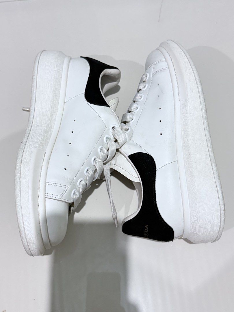 Alexander McQueen Oversized Sneakers White Black Size 39 (Category: Sneakers) located in Paranaque City. Submitted by thousandfold (Listing ID 1455257453, Image 3). Description: - Authentic Alexander McQueen Oversized Sneakers - Color: White leather with black suede heel tab - Features gold logo on tongue and heel - Size: 39 - Condition: Pre-owned, soles show dirt but plenty of wear left - Can swap to catfood for strays , or offer your items .