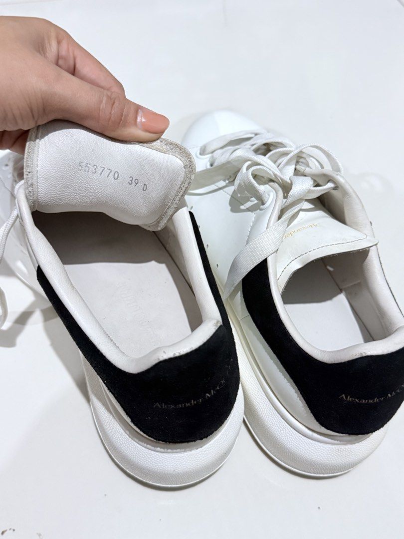 Alexander McQueen Oversized Sneakers White Black Size 39 (Category: Sneakers) located in Paranaque City. Submitted by thousandfold (Listing ID 1455257453, Image 2). Description: - Authentic Alexander McQueen Oversized Sneakers - Color: White leather with black suede heel tab - Features gold logo on tongue and heel - Size: 39 - Condition: Pre-owned, soles show dirt but plenty of wear left - Can swap to catfood for strays , or offer your items .