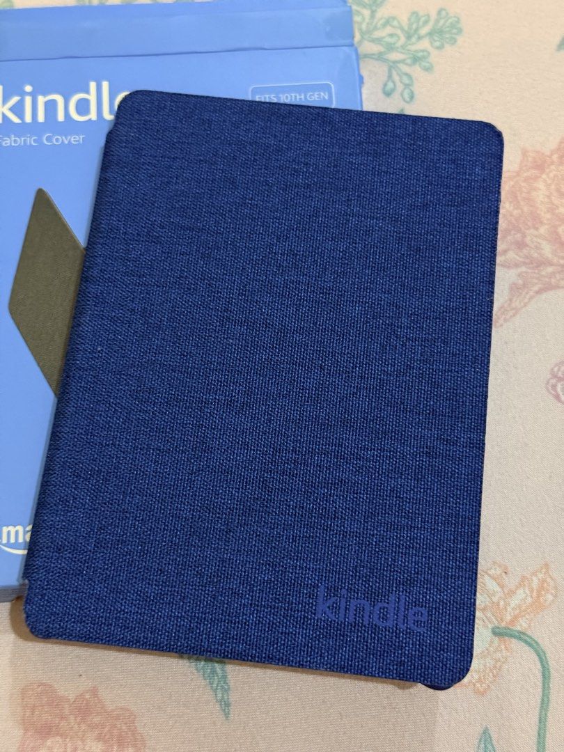 Amazon Kindle Fabric Cover for 10th Gen Kindle (Category: E-Readers) located in Hermosa. Submitted by bookwormhermosa (Listing ID 1455261118, Image 3). Description: - Blue fabric cover for 10th Gen Kindle - Protects your device - Snug fit - Comes with original packaging - Keeps your Kindle safe and looking good.