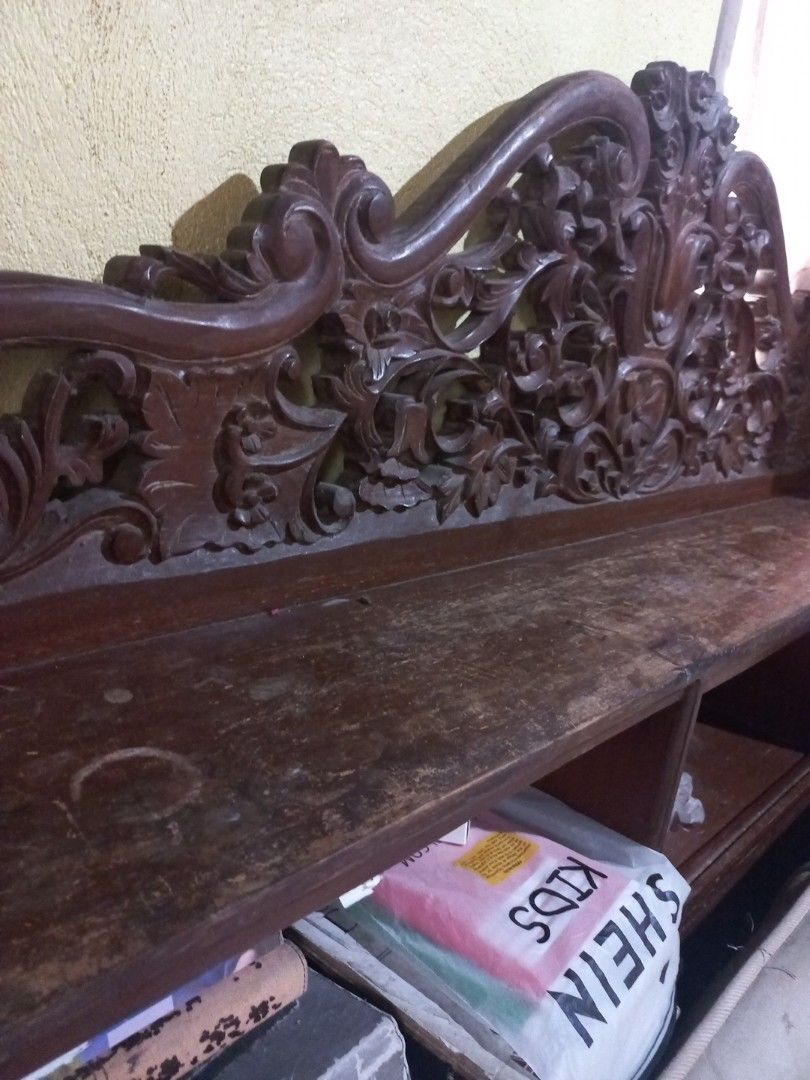Narra headboard and 2 narra side table/cabinets (Category: Shelves, Cabinets & Racks) located in Cavite. Submitted by ellave (Listing ID 1455174829, Image 1). Description: - Beautiful wooden shelf with detailed side carvings. - Multiple compartments for ample storage. - Rich, dark wood finish. - Ideal for displaying books or decorative items. - 2 side tables/cabinet Price negotiable .
