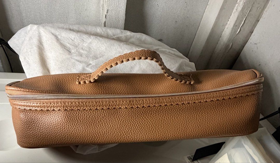 Arnold Wills Accessory Bag (Category: Luxury Bags & Wallets) located in Quezon City. Submitted by arterg (Listing ID 1455151409, Image 1). Description: Bought US Accessory Bag for hair iron, makeup etc Brown pebbled leather vanity case or accessory bag, featuring distinctive whipstitched detailing along the upper trim and a braided or stitched top carry handle. While it shares similar craftsmanship and textured leather finishes with several premi