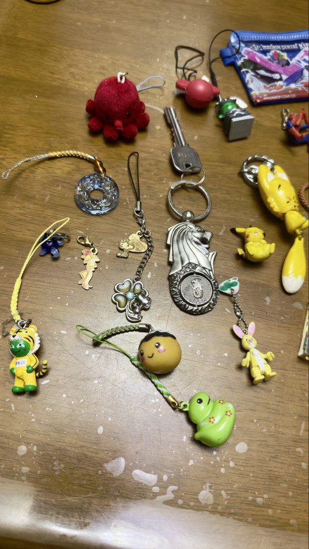 Assorted Keychain Charms: Anime, Car, Animals, and More! (Category: Character Goods) located in Pilar. Submitted by faveanyshop (Listing ID 1455249916, Image 2). Description: - Adorable keychain charms perfect for decorating bags and keys. - Featuring a variety of designs: anime characters, Spiderman, Pikachu, a cute fox, and a car. - Special souvenirs from Singapore: Merlion and Universal Studios Singapore charms. - Great for personalizing your 
