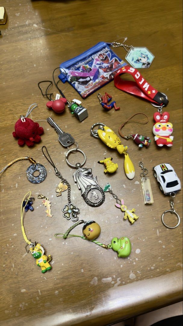 Assorted Keychain Charms: Anime, Car, Animals, and More! (Category: Character Goods) located in Pilar. Submitted by faveanyshop (Listing ID 1455249916, Image 1). Description: - Adorable keychain charms perfect for decorating bags and keys. - Featuring a variety of designs: anime characters, Spiderman, Pikachu, a cute fox, and a car. - Special souvenirs from Singapore: Merlion and Universal Studios Singapore charms. - Great for personalizing your 