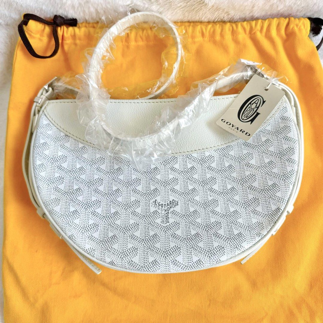 Authentic Goyard Hirondelle White Moon Bag (Category: Luxury Bags & Wallets) located in Quezon City. Submitted by aylahphia (Listing ID 1455163918, Image 1). Description: Goyard Hirondelle White bnew unused (2024) still w plastic and tag inclu: dust bag 🏷️ sale price from 120k posted For serious buyers, additional photos can be given upon request. Item is guaranteed authentic. Money-back if fake. Buyer may request for authentication at their exp