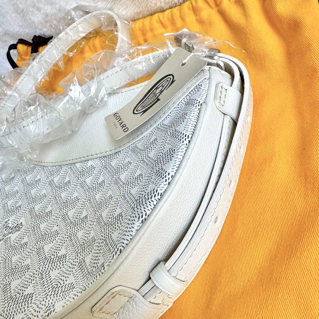 Authentic Goyard Hirondelle White Moon Bag (Category: Luxury Bags & Wallets) located in Quezon City. Submitted by aylahphia (Listing ID 1455163918, Image 2). Description: Goyard Hirondelle White bnew unused (2024) still w plastic and tag inclu: dust bag 🏷️ sale price from 120k posted For serious buyers, additional photos can be given upon request. Item is guaranteed authentic. Money-back if fake. Buyer may request for authentication at their exp