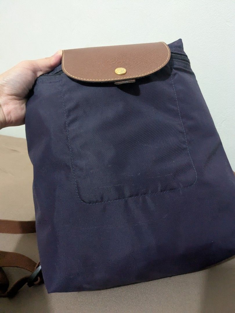 Authentic Longchamp backpack (Category: Luxury Bags & Wallets) located in Tuguegarao City. Submitted by globeeneace (Listing ID 1455255422, Image 3). Description: Guaranteed Original issue: Missing puller and minimal bubbles.