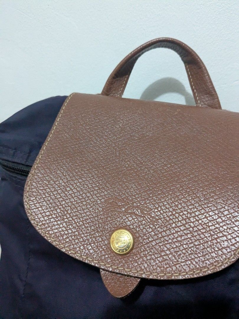 Authentic Longchamp backpack (Category: Luxury Bags & Wallets) located in Tuguegarao City. Submitted by globeeneace (Listing ID 1455255422, Image 2). Description: Guaranteed Original issue: Missing puller and minimal bubbles.
