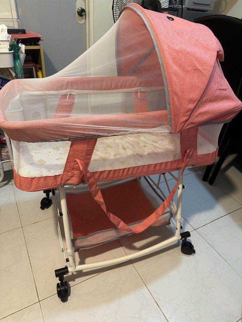 Bassinet with mosquitto net (Pink) (Category: Cots & Cribs) located in Paranaque City. Submitted by jamgb (Listing ID 1455236221, Image 2). Description: Selling our gently used baby bassinet. Still in excellent condition and well taken care of. 🩷 Condition: • Clean and ready to use • No tears or major stains • All wheels and locks are working properly • Used only for a month ❌NO TO LOWBALL OFFER ❌ Gcash 🚚 Lalamove J&T (Shipment day: Saturday).