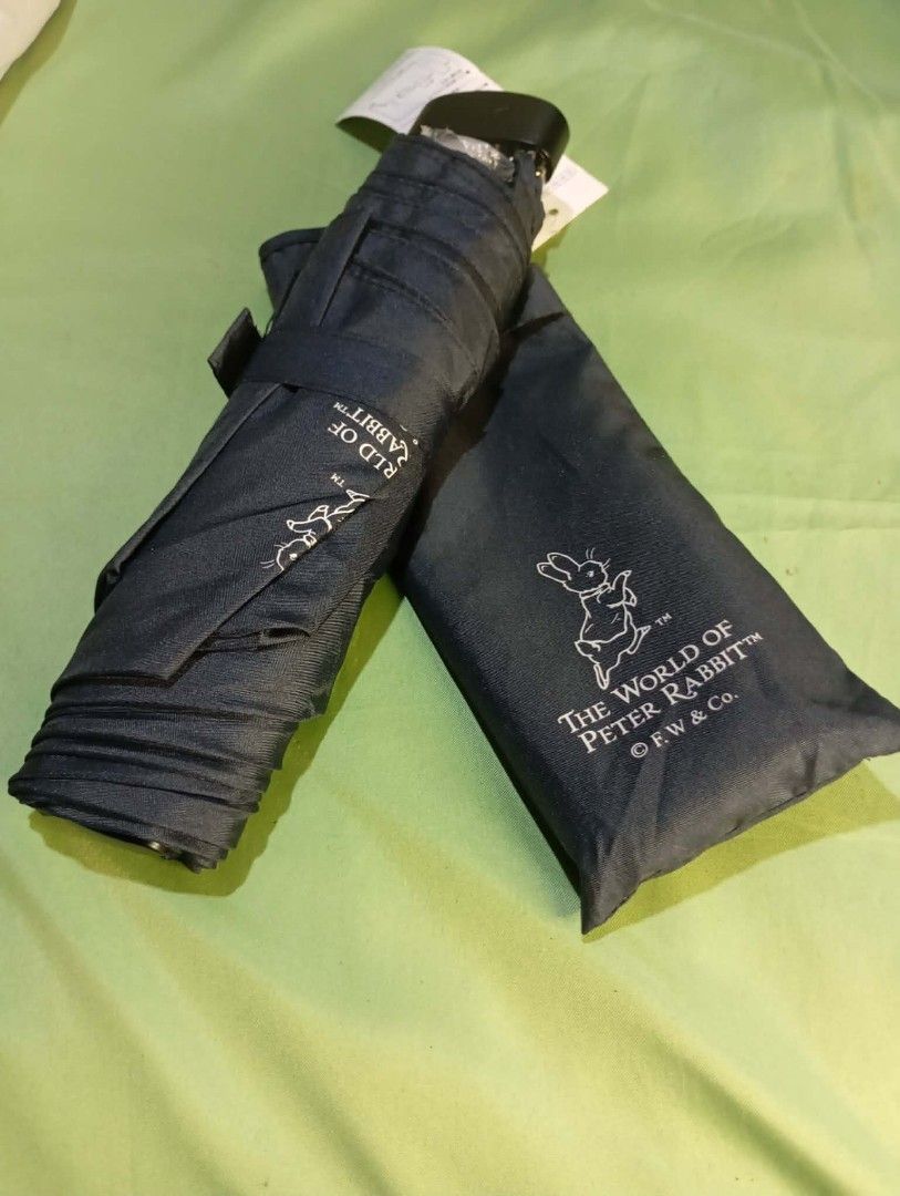 Foldable Umbrellas - Mario Valentino, Peter Rabbit, Pierre Cardin (Category: Umbrellas) located in Manila. Submitted by scherielar31543 (Listing ID 1455197568, Image 3). Description: foldable umbrellas - Includes: Navy blue Mario Valentino with sleeve - Dark blue Peter Rabbit with sleeve - Cream and black umbrella with dark sleeve - Purple and blue striped Pierre Cardin umbrella - Plain black umbrella available also other brand Puma, ungaro etc..