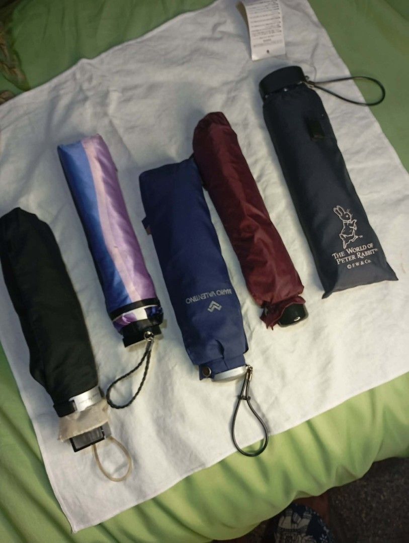 Foldable Umbrellas - Mario Valentino, Peter Rabbit, Pierre Cardin (Category: Umbrellas) located in Manila. Submitted by scherielar31543 (Listing ID 1455197568, Image 1). Description: foldable umbrellas - Includes: Navy blue Mario Valentino with sleeve - Dark blue Peter Rabbit with sleeve - Cream and black umbrella with dark sleeve - Purple and blue striped Pierre Cardin umbrella - Plain black umbrella available also other brand Puma, ungaro etc..