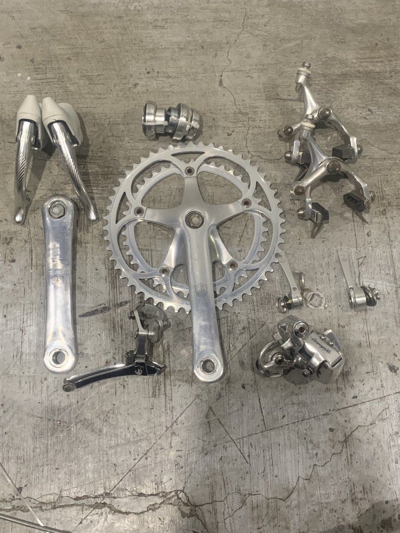 Campagnolo C Record Groupset (Category: Bicycles) located in Manila. Submitted by mnlbike (Listing ID 1455206122, Image 1). Description: Campagnolo Record Groupset Crank 52/42t 170mm campy screw ( no dust cup) Campagnolo c record syncro shifter (rare and complete) Campagnolo Delta lever Campagnolo record Caliper with Campagnolo Pads Campagnolo Croce de aune Rd 7 speed Campagnolo record FD Campagnolo c record Headset ( threaded ).
