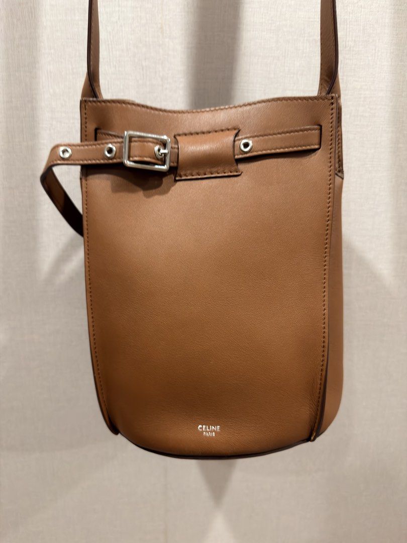 CELINE Paris (Auth) Tan Leather Crossbody Bag (Category: Luxury Bags & Wallets) located in Pasig City. Submitted by theclosetcasemanila (Listing ID 1455305029, Image 1). Description: - Guaranteed Authentic - Celine smooth tan leather crossbody bag - Elegant belt buckle closure on the front. Adjustable. - Classic, minimalist design - Very chic and unique - Expertly crafted in Italy No flaws. In good as new condition. No scratches. With dustbag. Ap