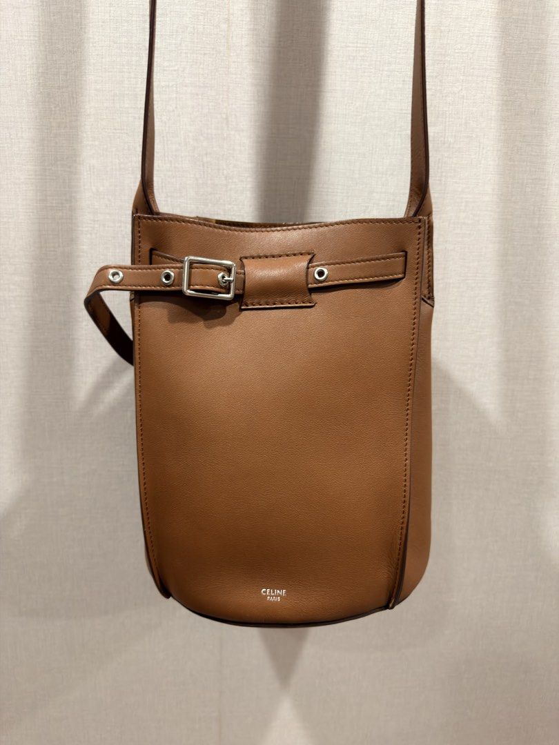 CELINE Paris (Auth) Tan Leather Crossbody Bag (Category: Luxury Bags & Wallets) located in Pasig City. Submitted by theclosetcasemanila (Listing ID 1455305029, Image 2). Description: - Guaranteed Authentic - Celine smooth tan leather crossbody bag - Elegant belt buckle closure on the front. Adjustable. - Classic, minimalist design - Very chic and unique - Expertly crafted in Italy No flaws. In good as new condition. No scratches. With dustbag. Ap