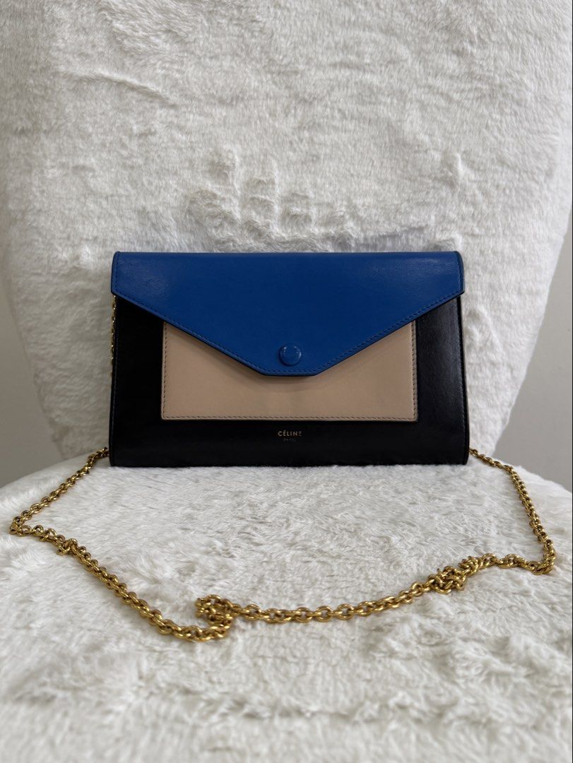FASTBREAK SALE Celine Tri-Color Leather Envelope Wallet on Chain (Category: Luxury Bags & Wallets) located in Quezon City. Submitted by closet24 (Listing ID 1455244515, Image 1). Description: - Celine Envelope Clutch - Colors: Black, Beige, Royal Blue Leather - Gold Chain Strap detachable - Snap Button Closure - Clean Interior No major flaws, only signs of use Rating 7.9/10 Not sure if touched up on the blue part hence the price. Inclusions Dust 